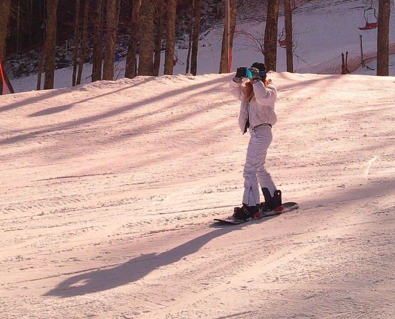 snowboarding lady using camp snap camera