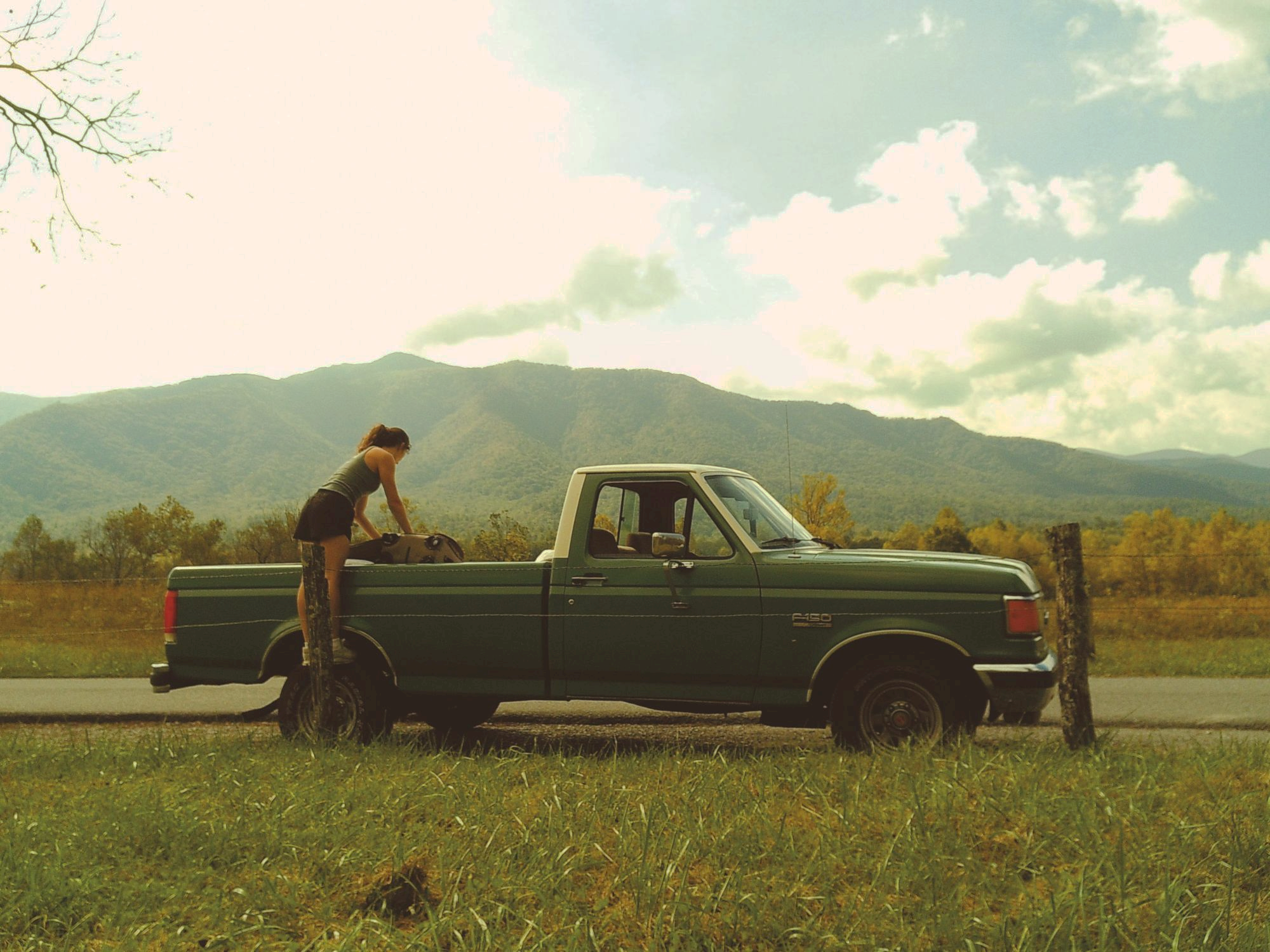 picture of a lady and a truck